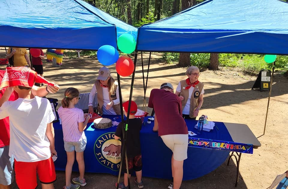 Guests are greeted at the park pop-up for a summer program